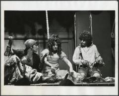 [June Gable as the Old Woman, Deborah St. Darr as Pacquet, and Mark Baker as Candide in the Chelsea Theater Center production of "Candide" during BAM Fall Series, 1973]