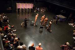 [Wilmer Wilson IV, Lawrence Graham-Brown, Clifford Owens, and Rocheford Belizaire with dog handlers and audience in a scene from the Dread Scott production "Decision" part of "Brooklyn Bred" during the BAM Next Wave Festival, 2012]